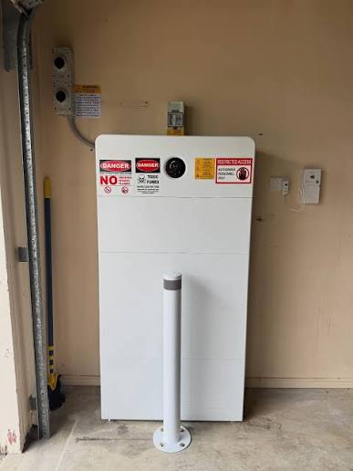 Home battery installation with protective bollard